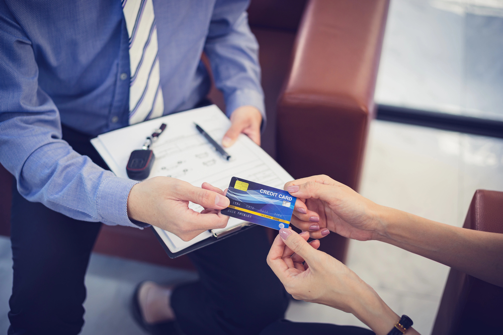 Customer using a credit card, illustrating high risk merchant payment
