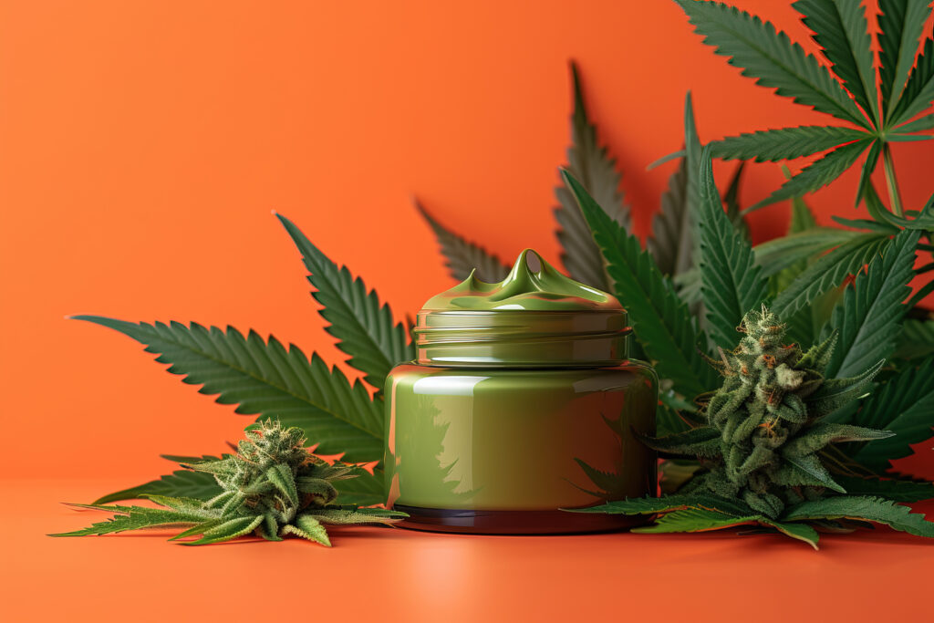 A luxury cosmetic cream jar set against a warm, sunlit background of cannabis leaves, highlighting premium offerings for a shopify CBD brand.