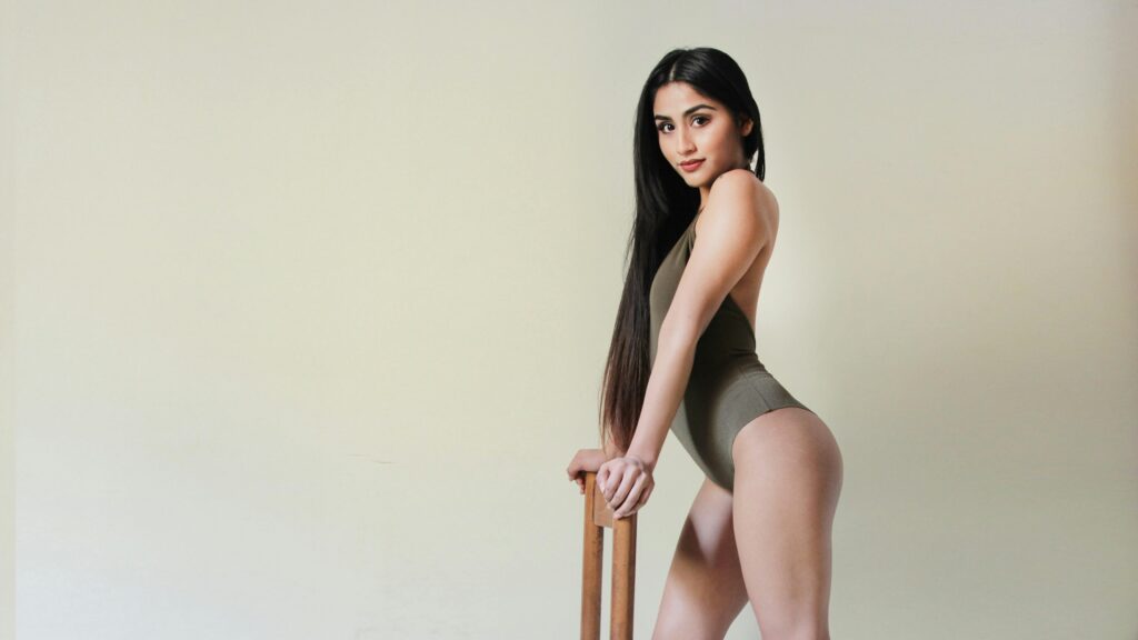 Woman model posing near a chair